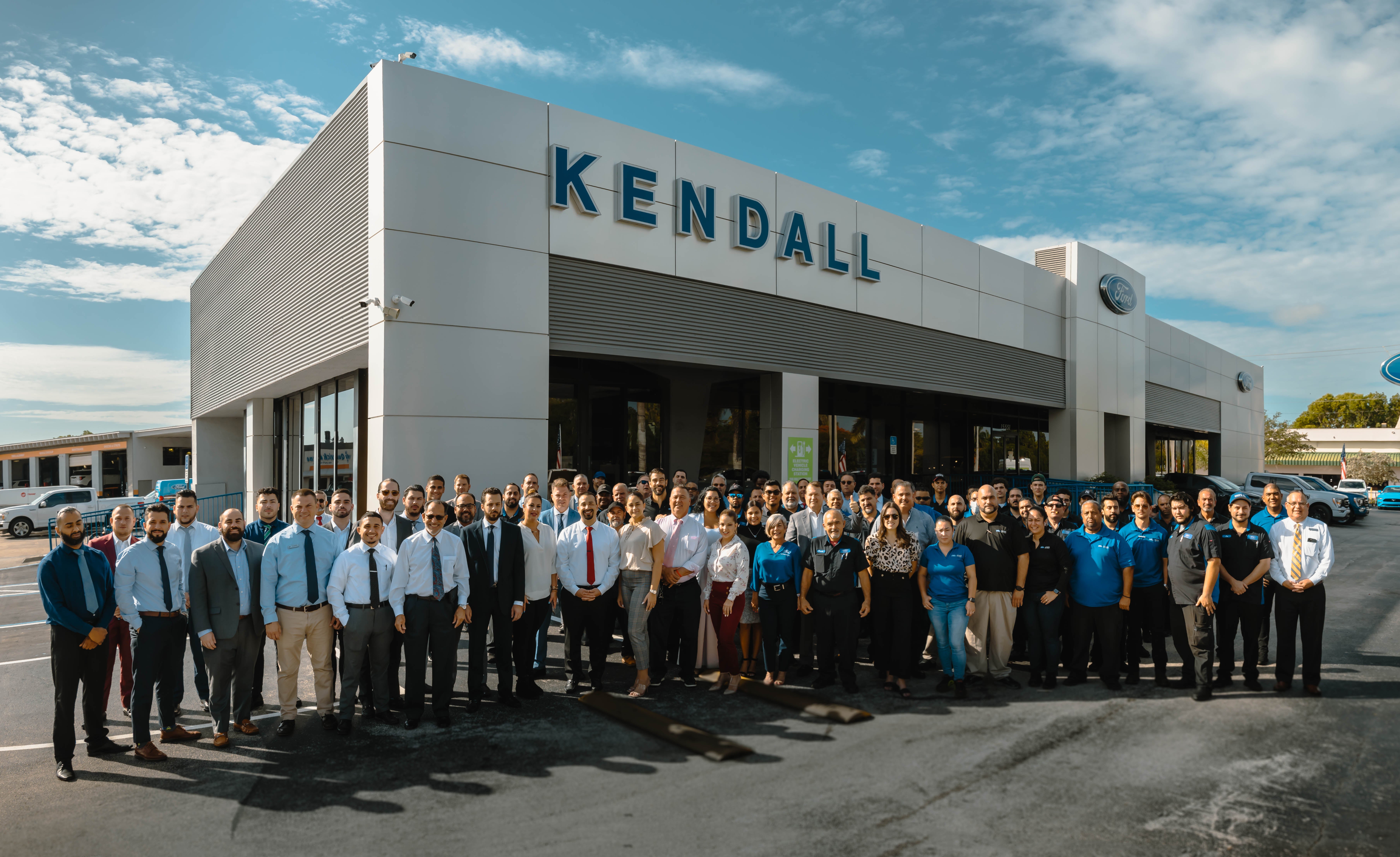 Picture of Kendall Dealership with staff out front